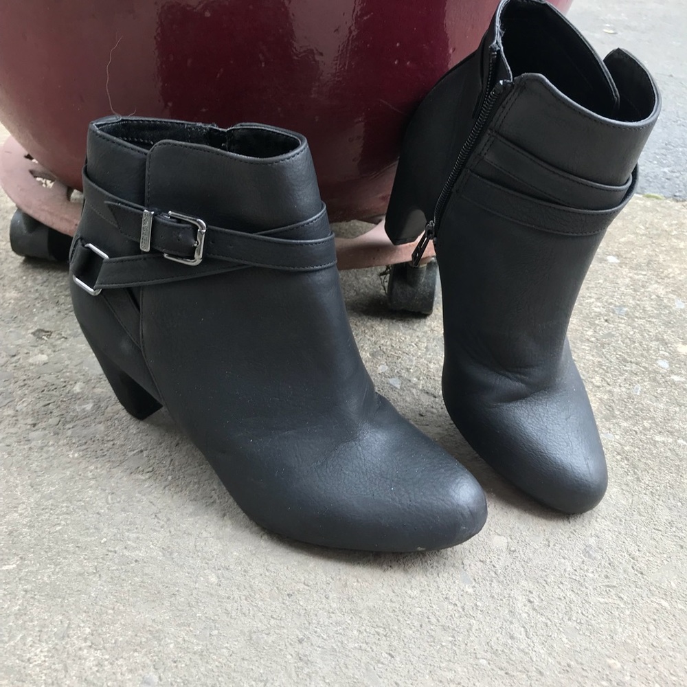 Black bootie shoes with buckles on side.